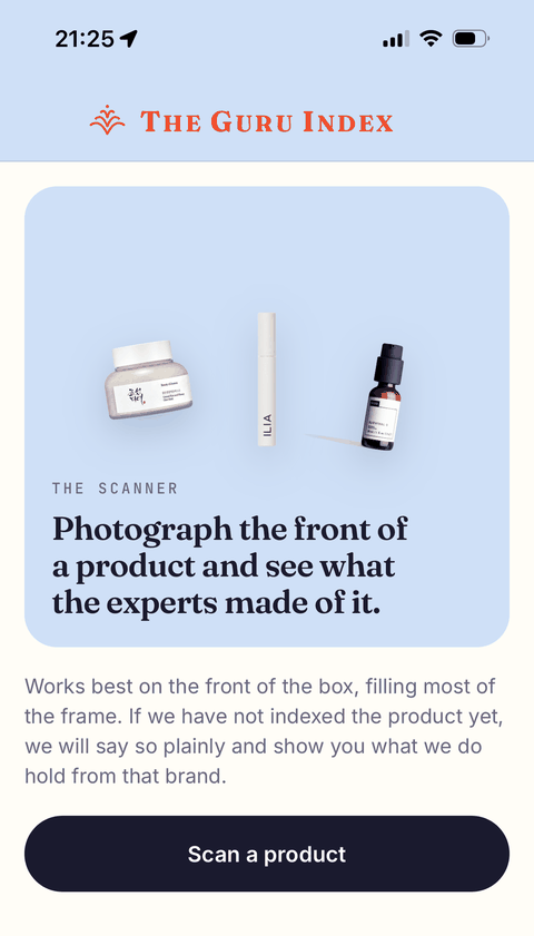 The scanner screen in The Guru Index iPhone app, showing three skincare products and an invitation to photograph the front of one.